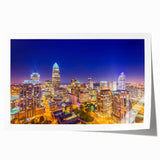 Rolled print of Charlotte, North Carolina skyline in muted gray and blue tones, suitable for art wall dining room.