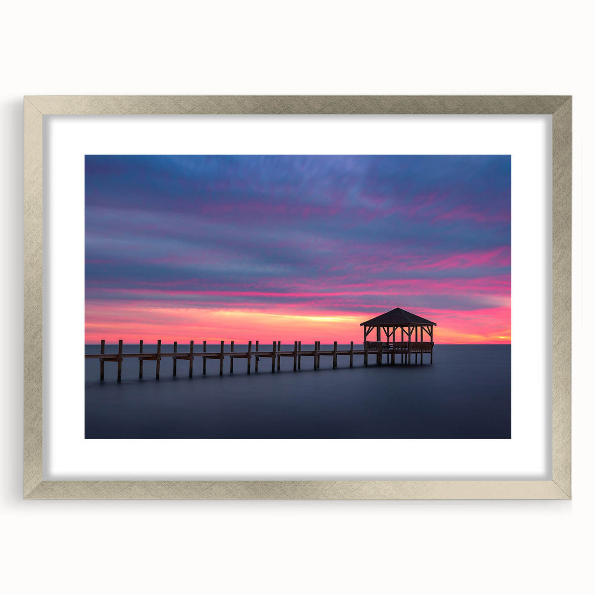 Textured abstract art print of the Outer Banks, featuring muted blue and gray tones on a framed silver mat.