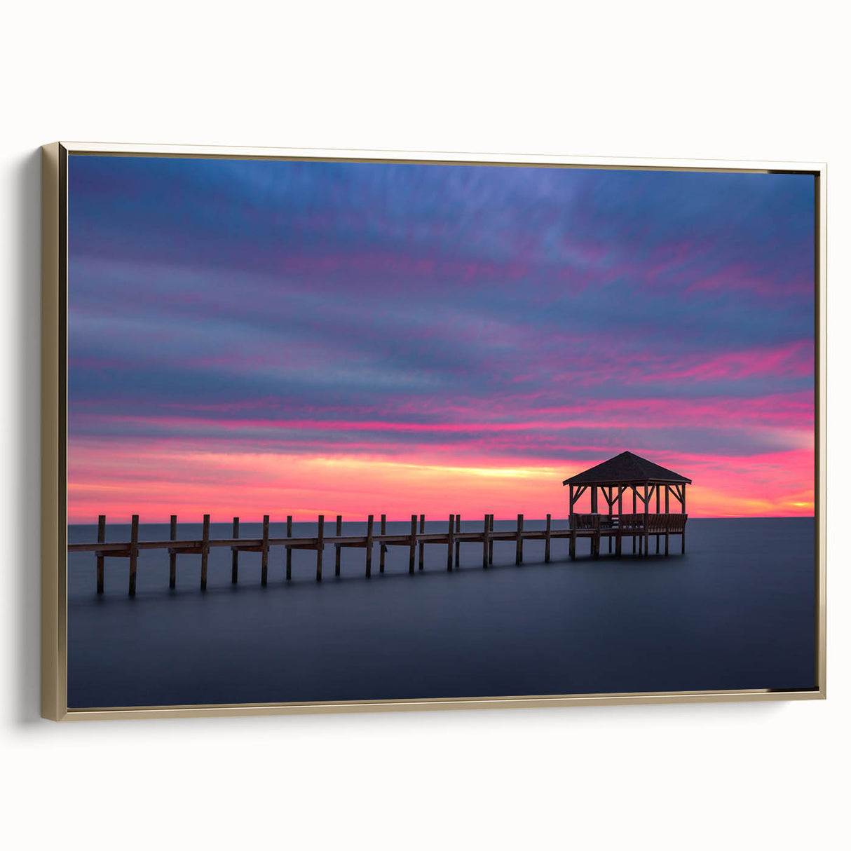 Framed canvas depicting a vintage-style landscape of the Outer Banks in North Carolina, featuring muted gold and black tones.