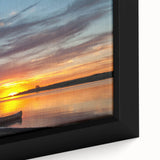 Close-up of a textured, black wall art depicting a colorful North Dakota scenery on a framed canvas.