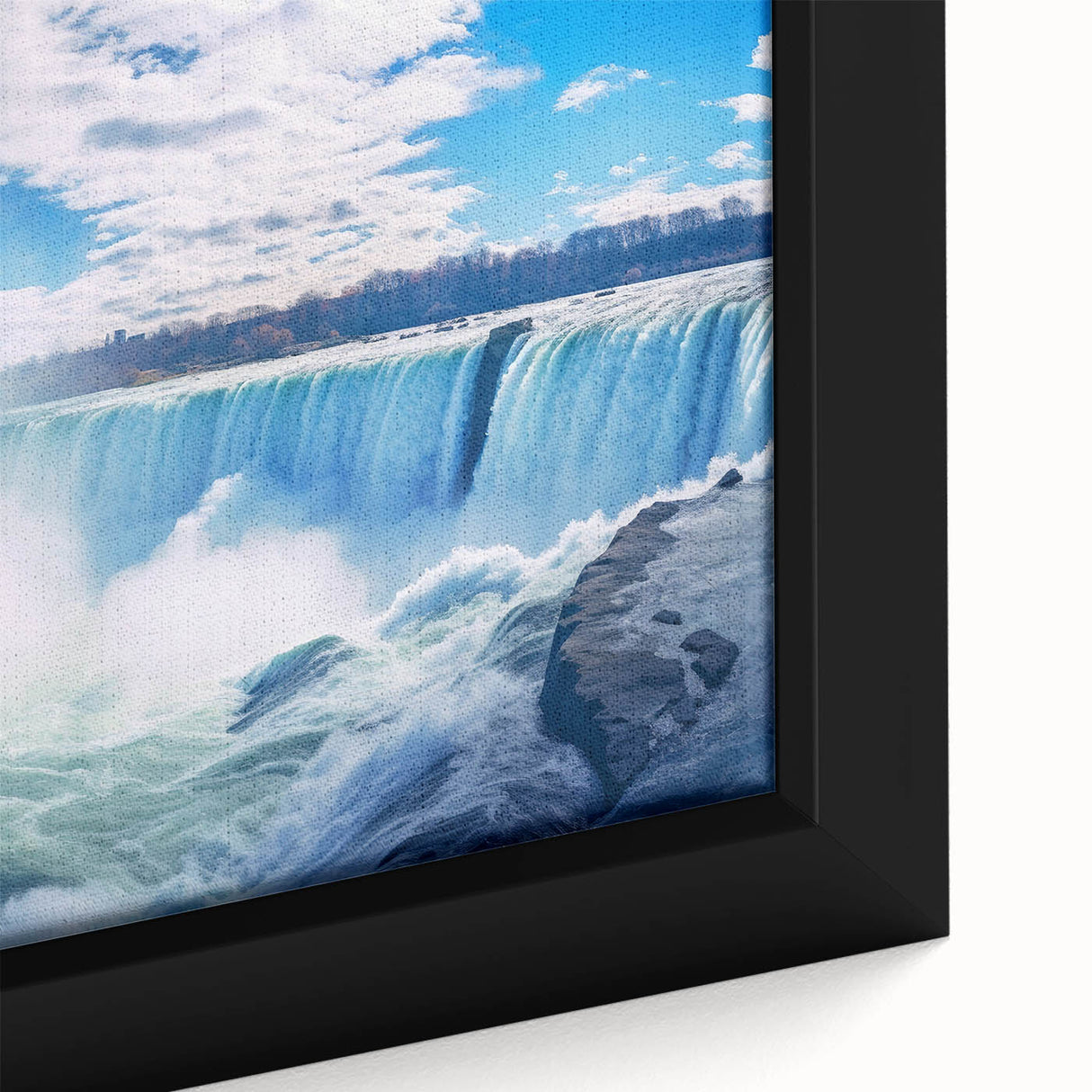 Close-up of a textured, black wall art depicting Niagara Falls in vibrant colors on a framed canvas.
