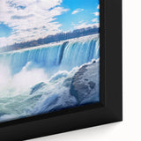 Close-up of a textured, black wall art depicting Niagara Falls in vibrant colors on a framed canvas.