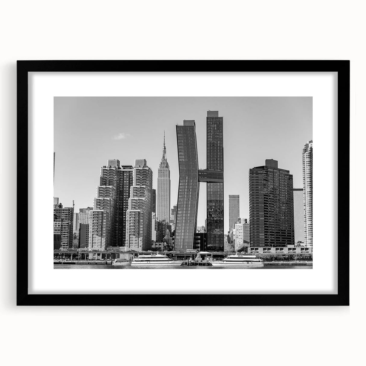 Abstract art print of the Chrysler Building in colorful, textured hues on a large black-framed canvas.