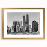 Extra large abstract art print featuring a textured depiction of the NYC Chrysler Building, in gold tones, framed with mat.