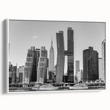 Vintage poster art of the Chrysler Building in monochrome with vibrant color accents, framed canvas.
