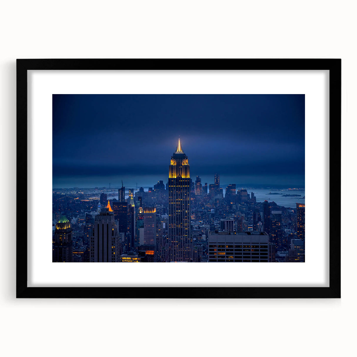 Abstract art print of NYC's Empire State Building in colorful, textured strokes on a large framed canvas.