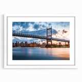 Abstract art print of the Manhattan Bridge in muted gray and blue tones, framed in white, suitable for dining room decor.