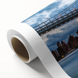Art Deco poster of Manhattan Bridge in gray and blue tones on rolled canvas.