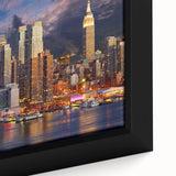 Extra large framed canvas of Manhattan skyline in black with colorful, textured accents, ideal for living room decor.