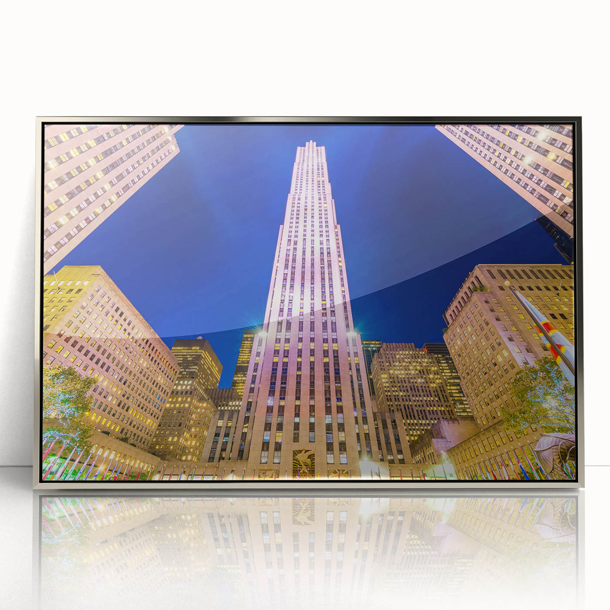 Mid-century modernist art of NYC Rockefeller Center in silver-framed acrylic, featuring muted urban colors.
