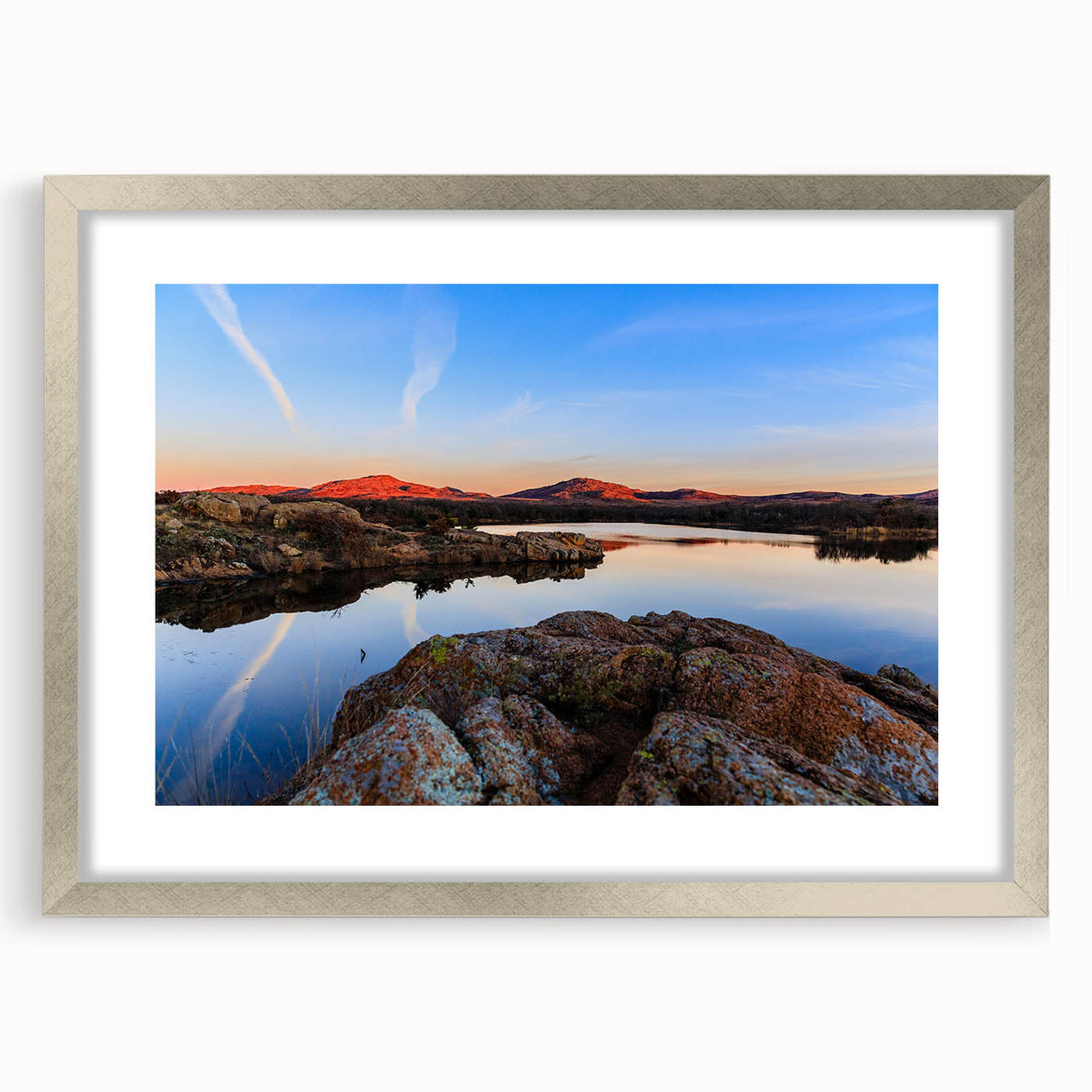 Textured art print of abstract Oklahoma scenery in muted earth tones, framed in silver, ideal for bedroom wall decor.