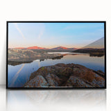 Large abstract wall art featuring dynamic shapes in muted earth tones on a framed acrylic.