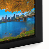 Framed canvas of a textured, colorful Portland, Oregon skyline on a black background, ideal for living room decor.