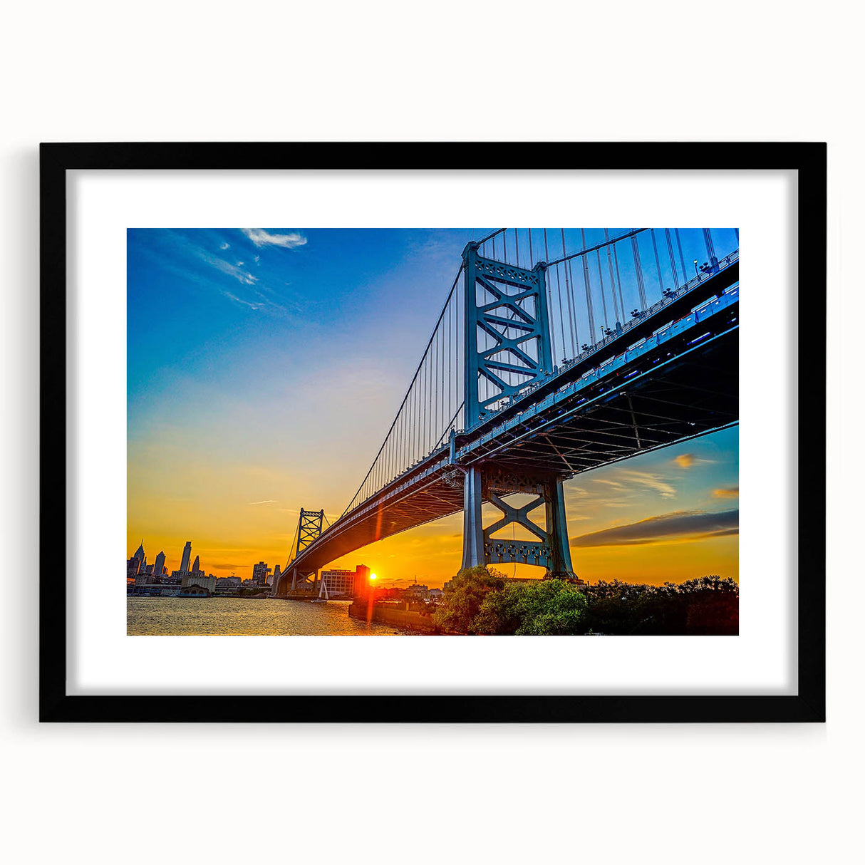 Abstract art print of Philadelphia skyline in vibrant colors on a large framed canvas, ideal for living room decor.