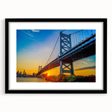 Abstract art print of Philadelphia skyline in vibrant colors on a large framed canvas, ideal for living room decor.