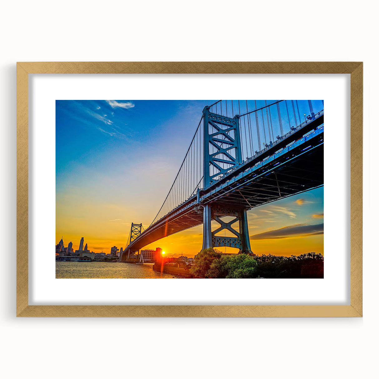 Abstract art print of Philadelphia skyline in muted gold and gray tones on a textured, framed canvas.