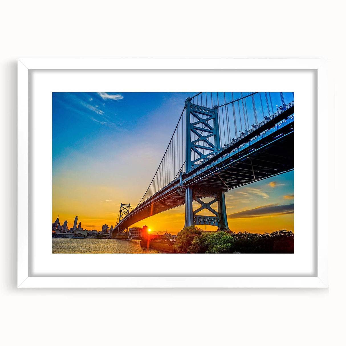 Abstract art print of Philadelphia skyline in muted blue and gray tones, framed in white, ideal for dining room decor.