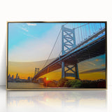 Framed acrylic print of Philadelphia skyline in gold and blue tones, ideal for modern art wall decor.