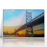 Art deco poster of the Philadelphia skyline in muted gray and blue tones on a framed acrylic.