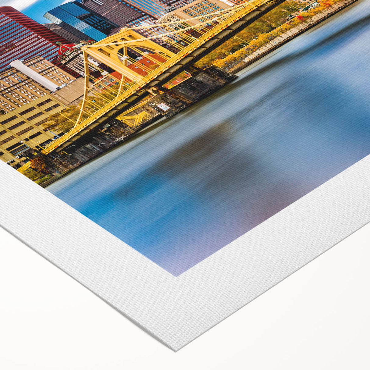 Art deco poster of Pittsburgh skyline in muted gold and blue tones on rolled canvas, suitable for dining room wall art.