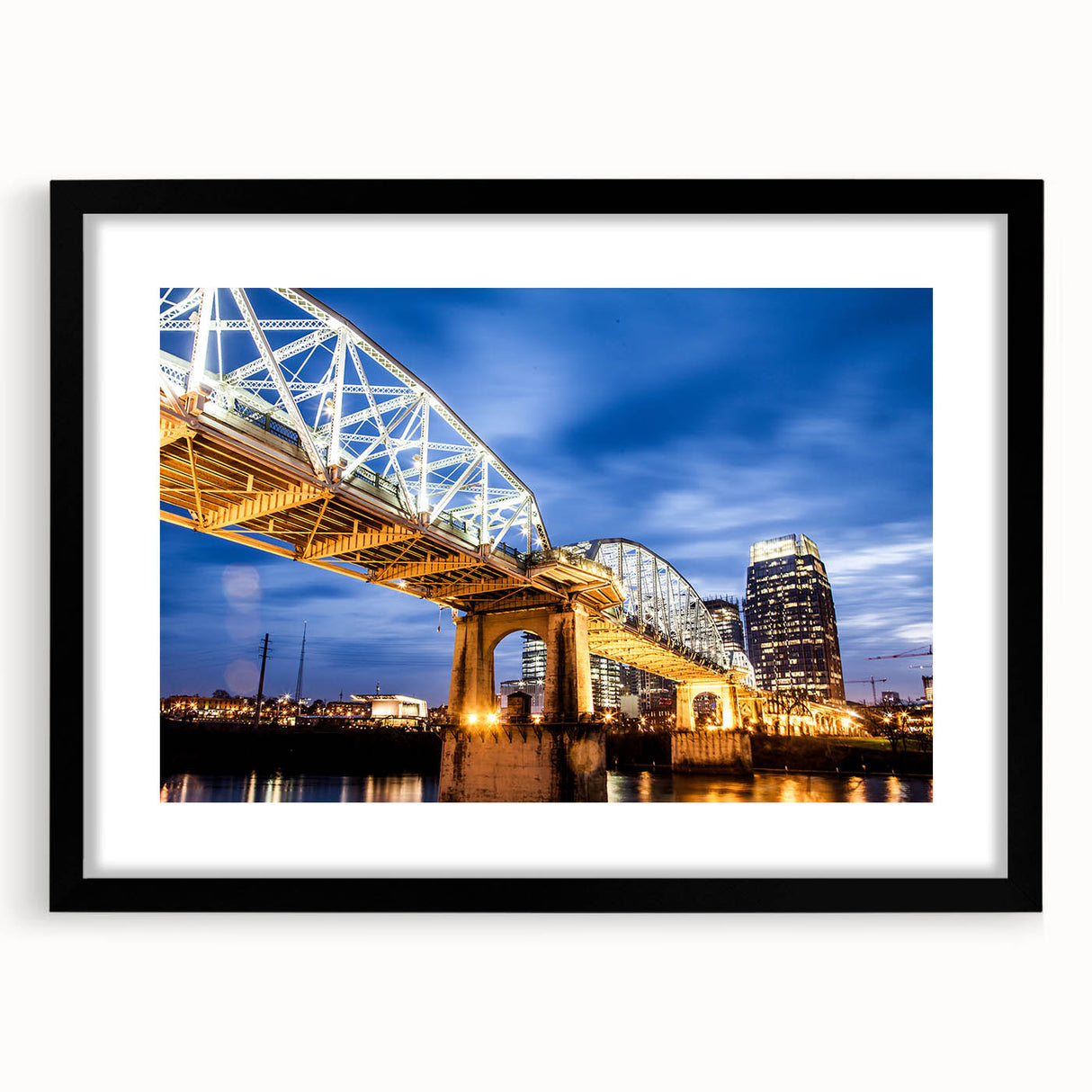 Abstract art print of Nashville with vibrant, colorful textures on a large black-framed canvas.
