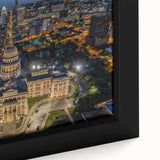 Close-up of a textured black wall art featuring a colorful Austin, Texas skyline on a framed canvas.