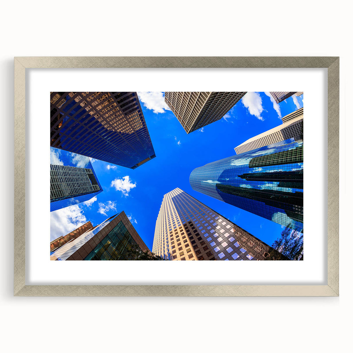 Textured abstract art print of Houston skyline in silver frame, using a palette of cool blues and grays.