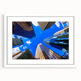 Abstract art print of Houston skyline in muted gray and blue tones, framed with a white mat, suitable for dining room decor.