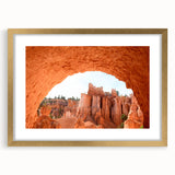 Extra large abstract art print of Bryce Canyon in textured shades of orange and red, framed in gold.