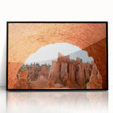 Large abstract wall art depicting Bryce Canyon in muted red and orange tones on a framed acrylic.