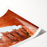 Extra large wall art of line art flowers with vibrant orange and red tones on a rolled print.