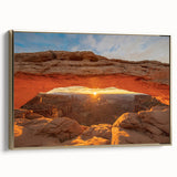 Framed canvas wall art featuring a vintage-style landscape painting of Canyonlands, with muted earth tones.