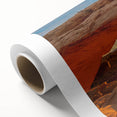 Art deco poster of Canyonlands with soft orange and blue hues on rolled canvas, suitable for nursery wall art.