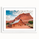 Abstract art print of Capitol Reef, Utah, in earthy red and brown tones, framed in white, ideal for dining room decor.
