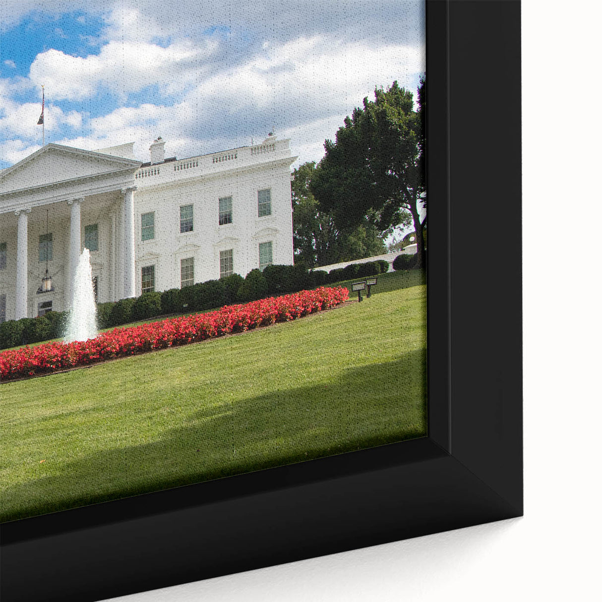 Close-up of a textured black wall art featuring the White House in vibrant colors on a framed canvas.