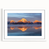 Abstract art print of Wyoming's Grand Tetons in muted earth tones, framed in white, ideal for dining room decor.