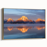 Framed canvas of Grand Tetons landscape in vintage poster style with a gold frame, suitable as wall art for a bedroom.