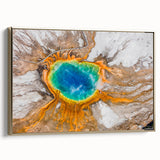 Framed canvas depicting Yellowstone landscape with vintage poster style in black and gold tones.