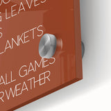 Large abstract wall art depicting autumn trees in orange and red tones on acrylic glass, suitable for dining room ambiance.