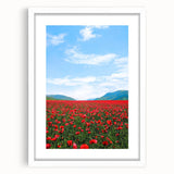 Abstract art print depicting spring with vibrant green and pink tones on a white framed canvas, ideal for dining room decor.