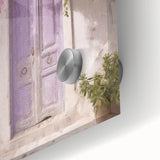 Close-up of a Greek door architecture in acrylic glass, featuring large abstract art prints in mid-century modernist style.