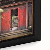 Close-up of a black framed canvas featuring a textured, colorful Japanese door design, suitable for living room decor.