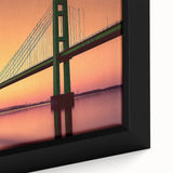 Close-up of a black framed canvas featuring a textured, colorful abstract design.