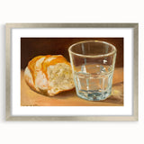 Textured art print of abstract pastries in muted browns and creams, framed in silver, ideal for bedroom wall decor.