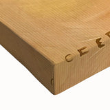 Close-up of a large art canvas showing a black and white photo of assorted pastries, ideal for bedroom wall decor.