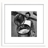 Abstract art print featuring a crowd of people in monochrome, framed in white, ideal for dining room decor.