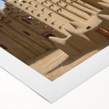 Art deco poster of a Mali scenery in muted earth tones on rolled canvas, suitable for dining room decor.