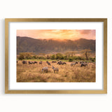 Abstract art print of a Tanzanian landscape in gold frame, featuring earthy tones, ideal for dining room decor.