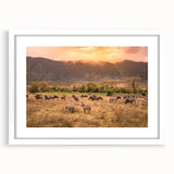 Textured abstract art print of a Tanzania landscape in muted earth tones on a white framed canvas.
