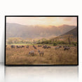 Large abstract wall art depicting a stylized Tanzanian landscape in muted earth tones, framed in black acrylic.